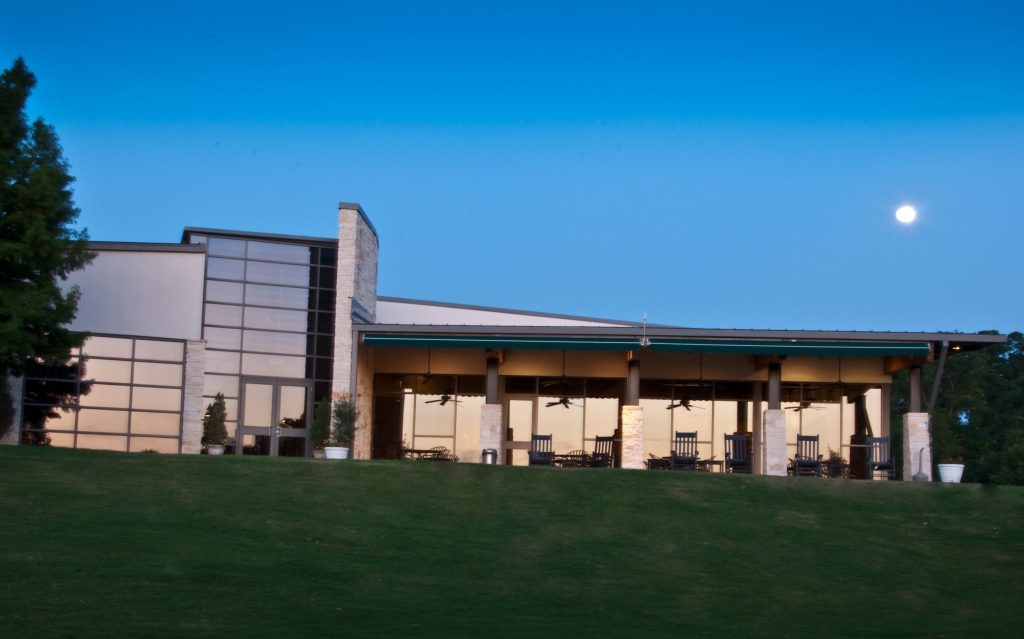 Bridges Clubhouse at Firewheel Golf Park under a dark blue sky